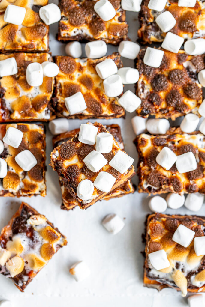 Overhead shot of rich chocolate Sweet Potato Brownies with a creamy orange sweet potato layer and gooey marshmallows.