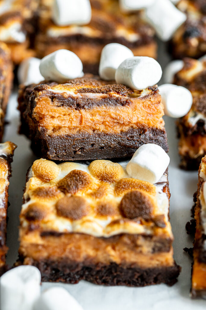 Layered Sweet Potato Brownie with a rich chocolate base and soft marshmallow topping, photographed from the side.